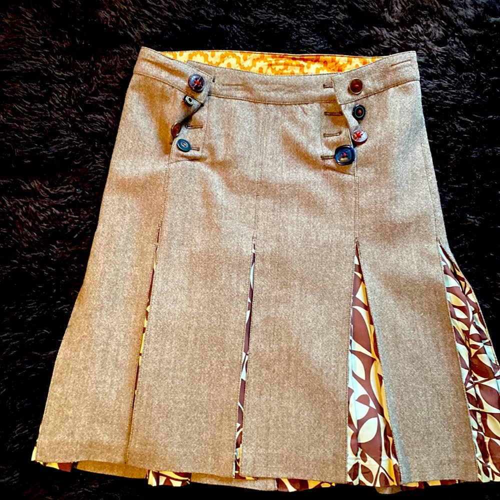 Accordion style with super cute button deatils wool skirt